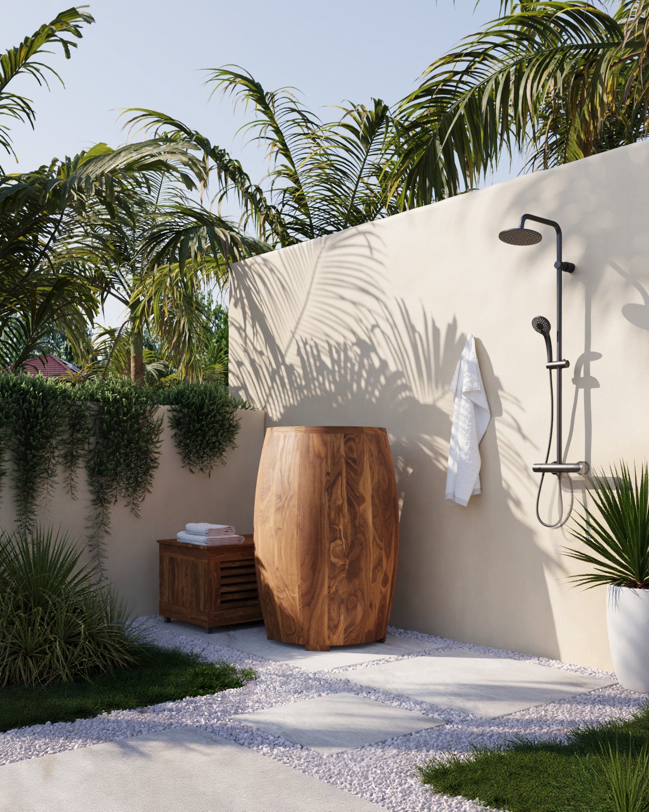 Outdoor shower area with wooden Ice bath barrel, towels, and palm trees
