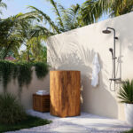 A handcrafted teak ice bath nestled in a serene outdoor setting, embodying the essence of cold therapy and luxury.