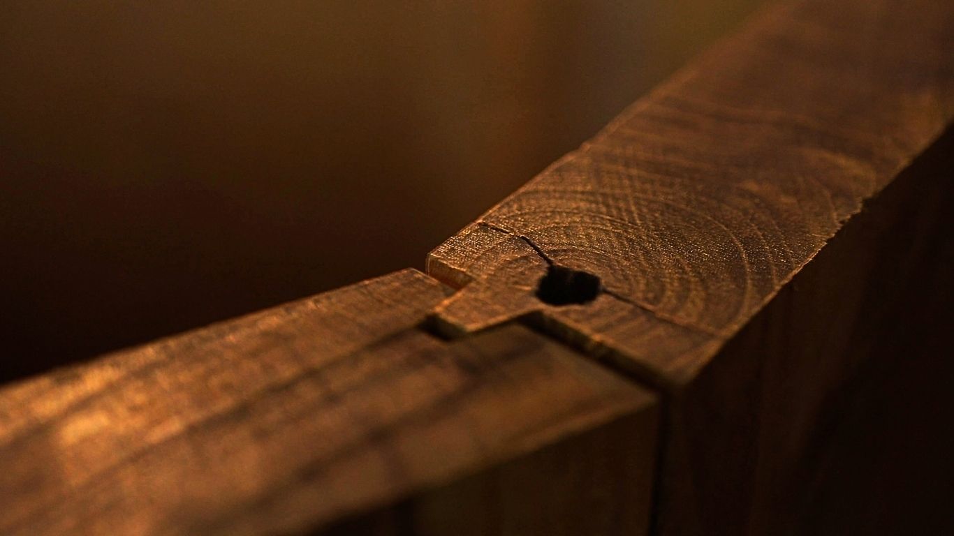 Teak tongue and groove panels being fitted during ice bath assembly in the icebaths.comm factory