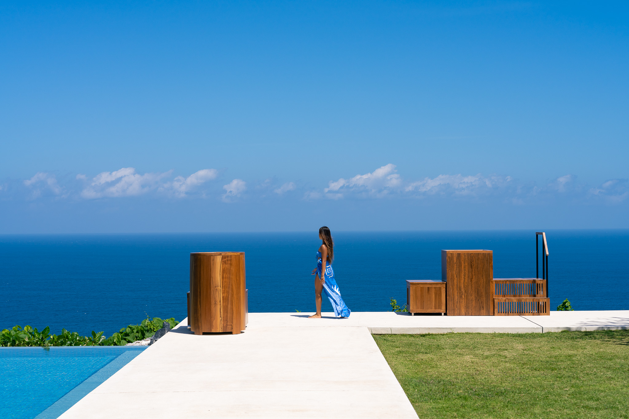 Teak Barrel ice bath on a clifftop terrace overlooking the ocean in Bali