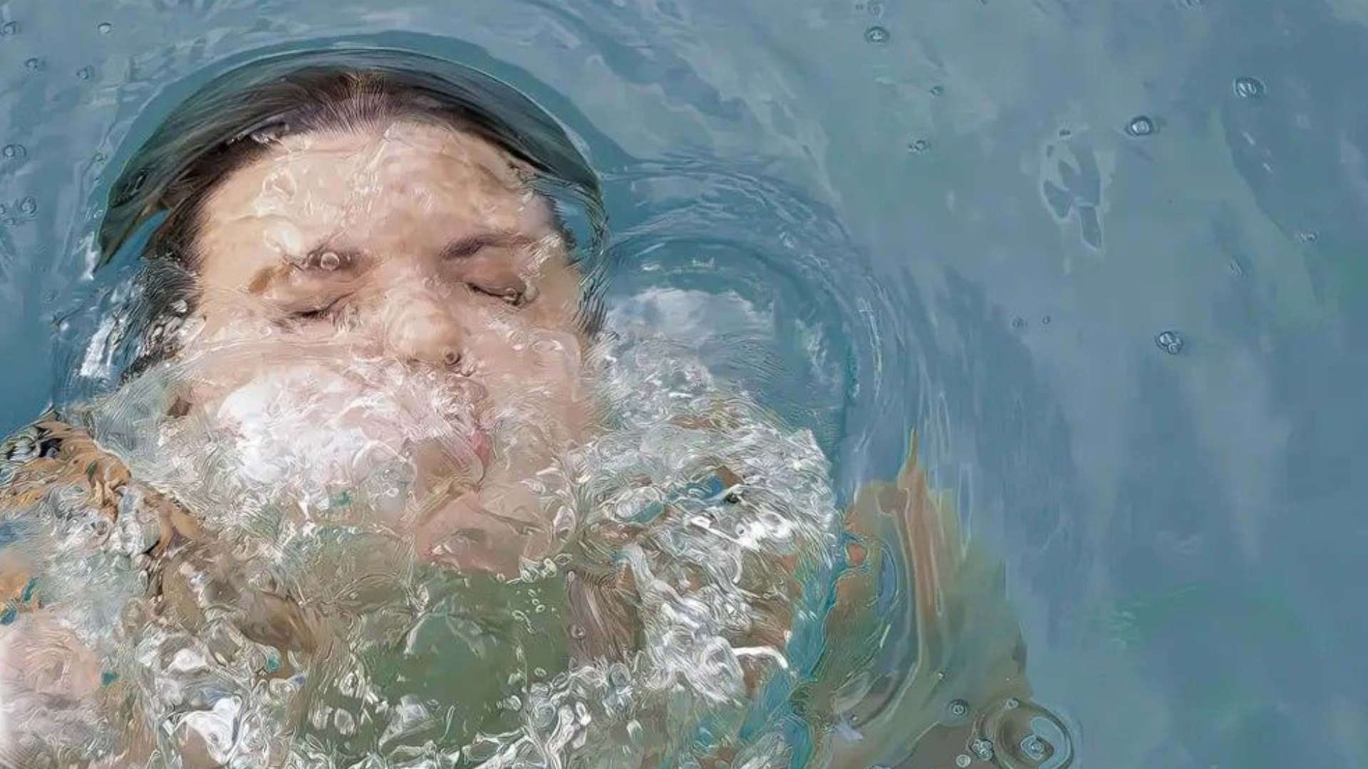 Close-up of hands resting on the edge of a cold plunge with a small timer nearby, illustrating that seconds—not suffering—drive the benefits