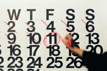 A diary on a white board with date scribbed out.
