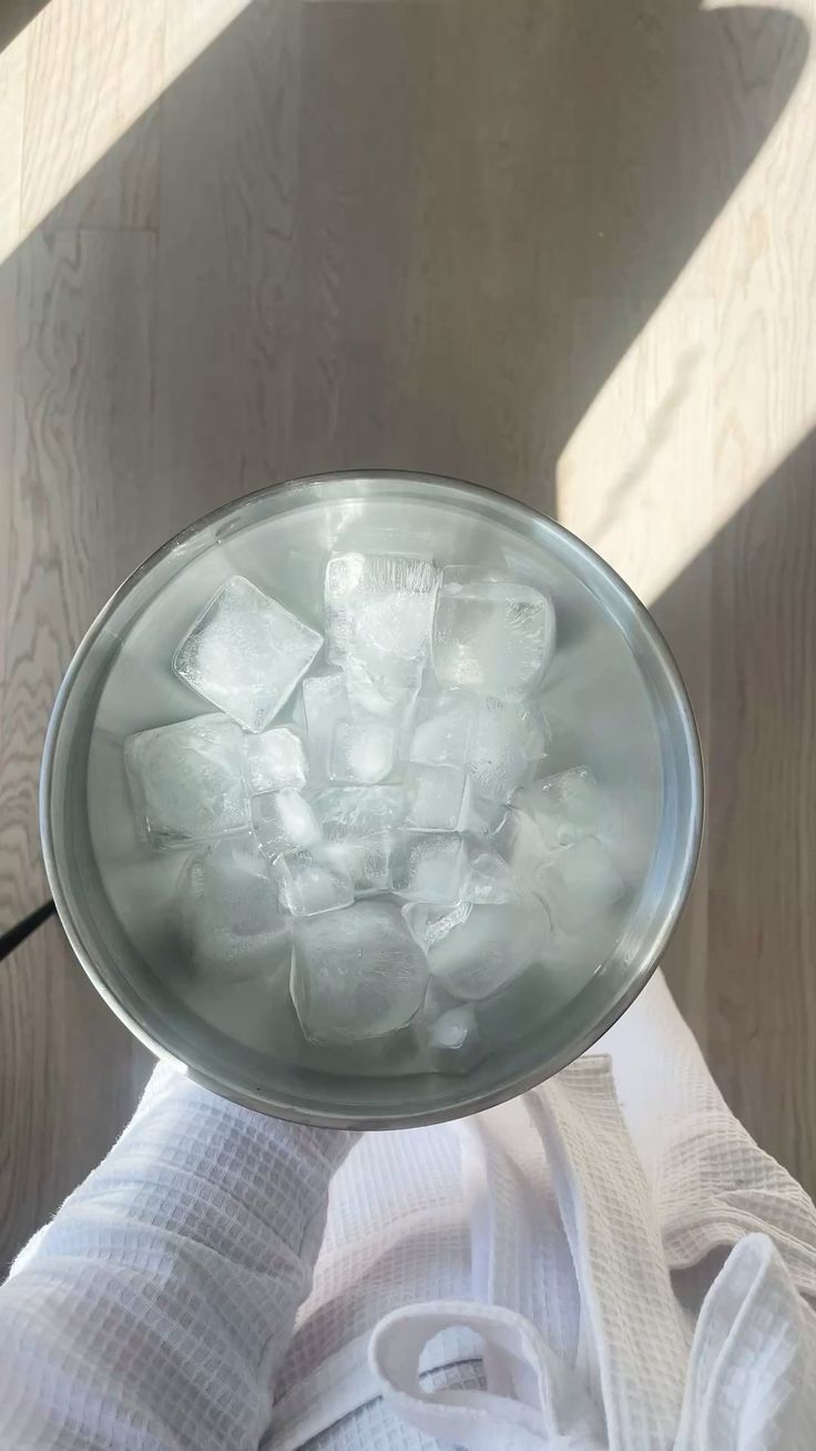 a bowl of water with some ice.
